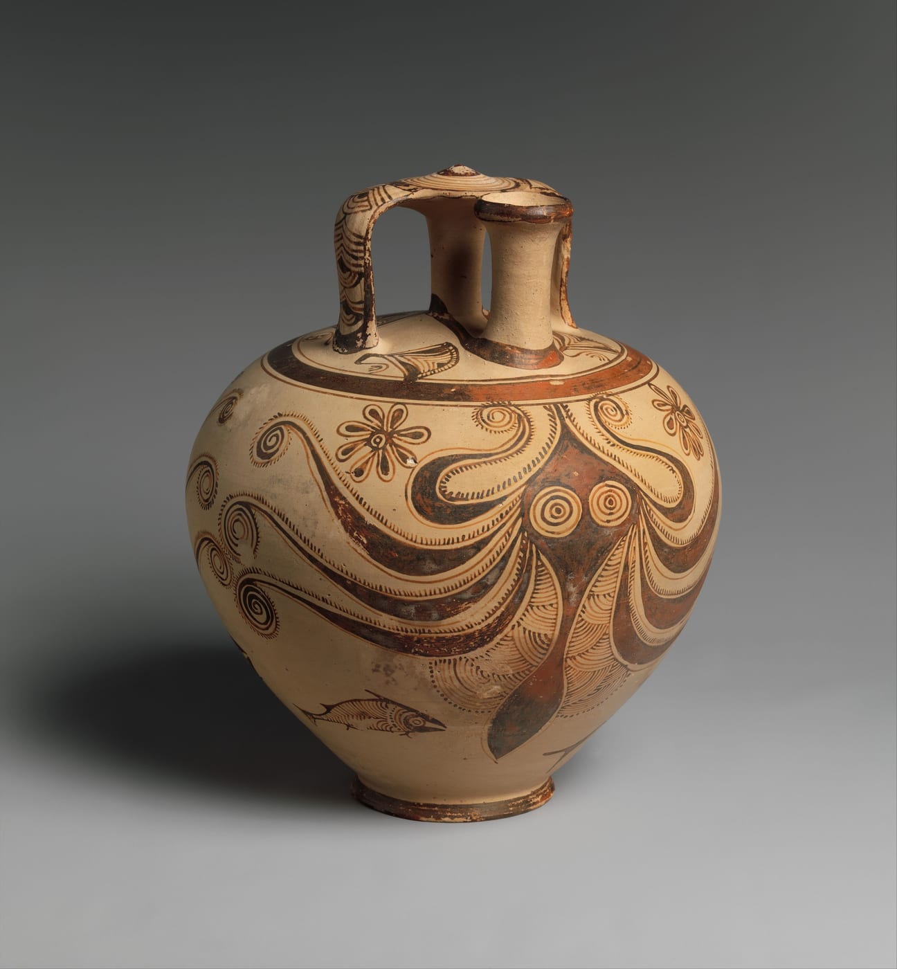 Round clay jar with a short handle and spout, painted in brown with an octopus whose tentacles wrap around the body